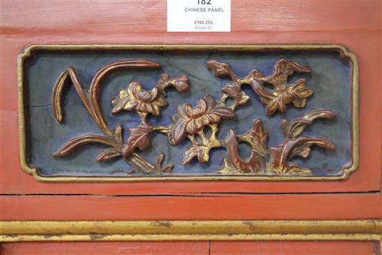 A Chinese gilt and red lacquered relief panel 84 x 32cm